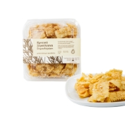 Simantiraki Cretan Xerotigana 240g packaging alongside a serving plate of crispy honey-dipped pastries.